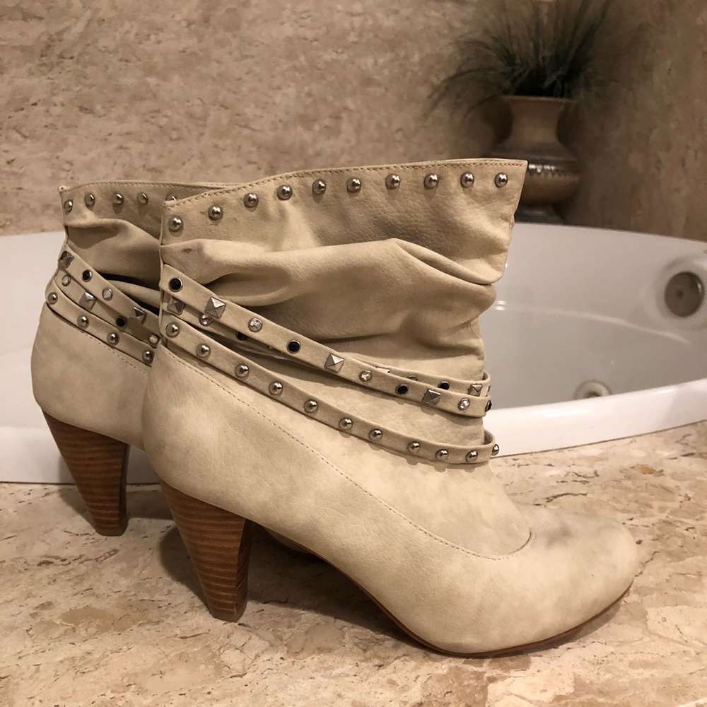Not Rated cream booties with studs.